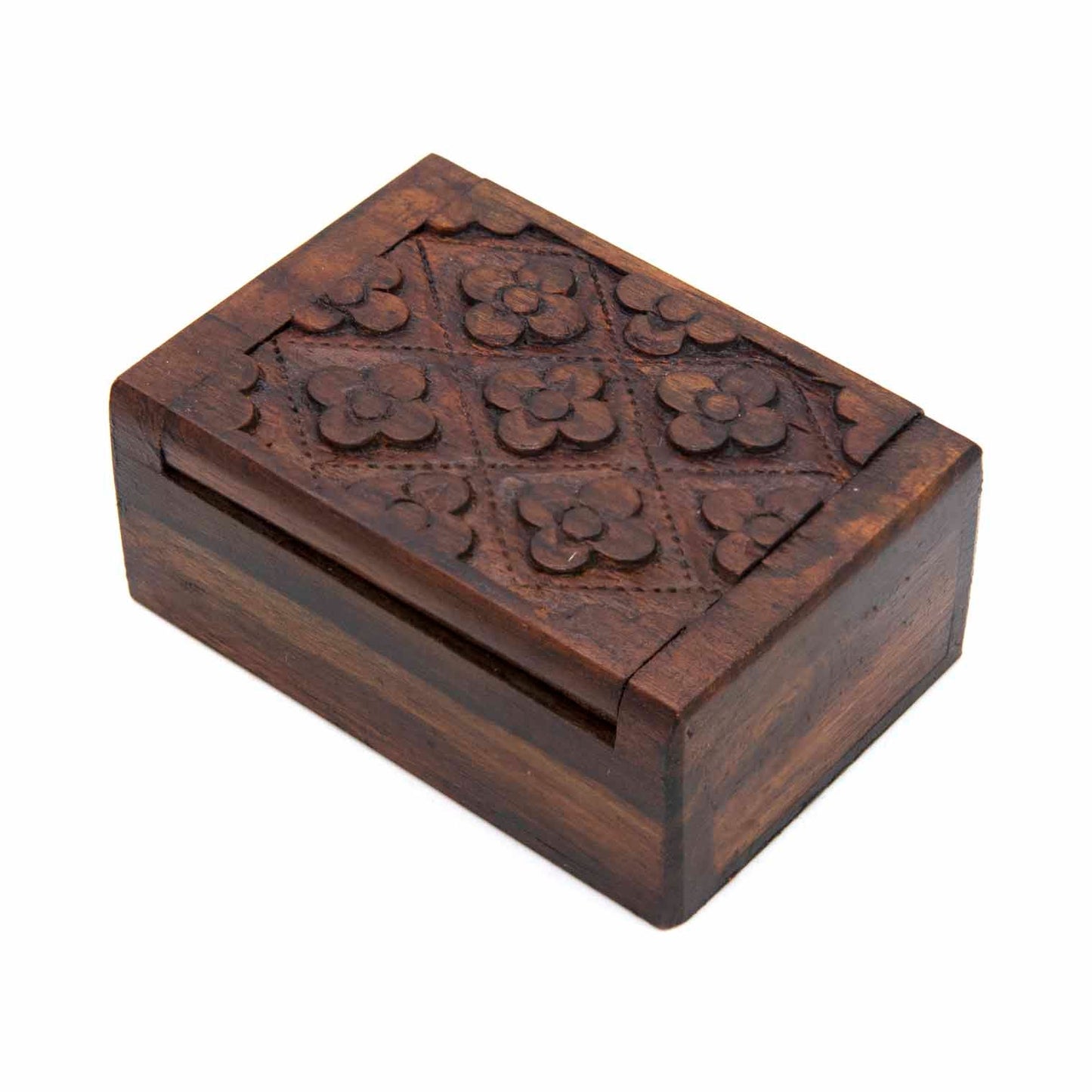 Three-quarter view of mini carved wood box with six-flower grid lid pattern, showing plain smooth sides