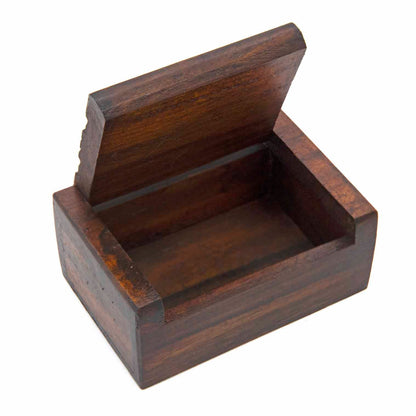 Open mini carved wood box showing plain dark interior compartment and hinged lid raised, white background
