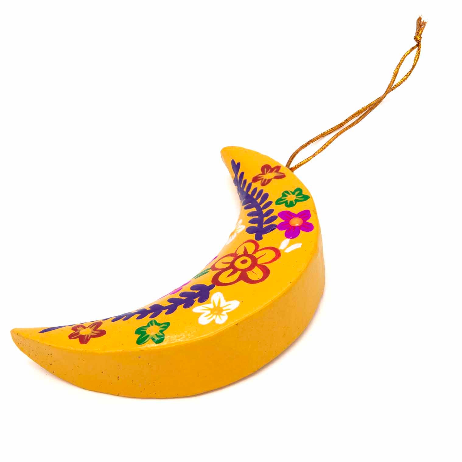 Yellow hand-painted wood crescent moon, angled side view showing depth of cut wood form