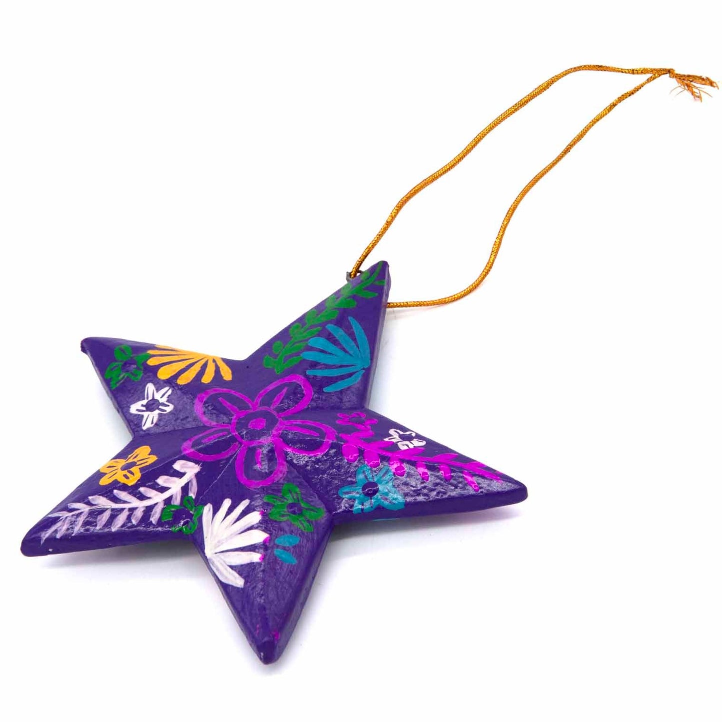 Deep purple hand-painted wood star, angled view showing domed surface and folk flower detail, Bali Indonesia