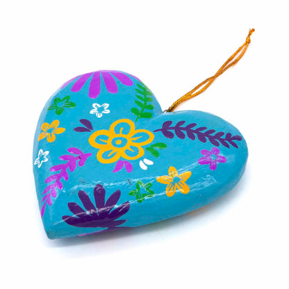 Teal hand-painted wood heart, angled view showing smooth domed surface and gold cord