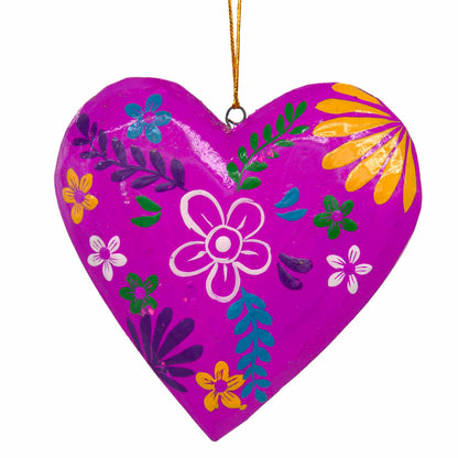 Magenta hand-painted wood heart, front view on white background showing white folk flower and leaf motifs