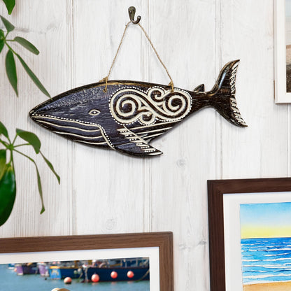 Hand-carved wooden whale plaque with tribal-style relief carving, made by artisans in Bali, Indonesia