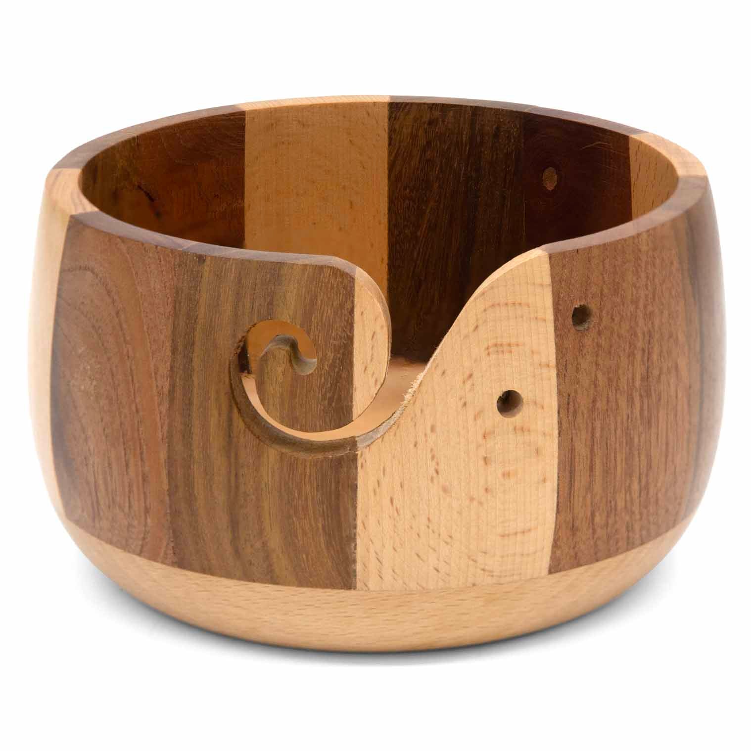 Turned hardwood yarn bowl with dark and pale striped wood, carved spiral yarn slot visible, India