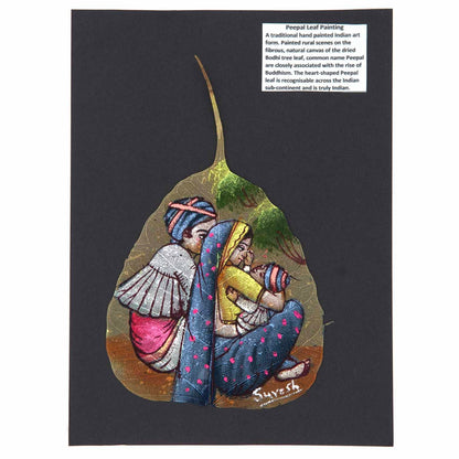Hand-painted peepal leaf showing Indian miniature family scene in jewel colours, mounted on dark card, India