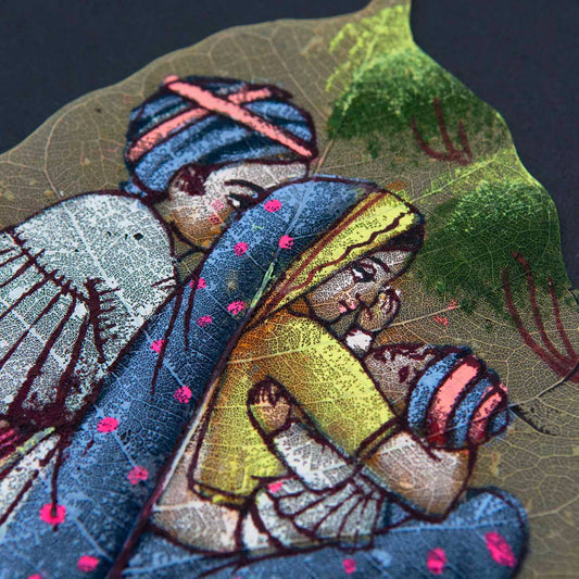 Close-up of peepal leaf painting showing fine brushwork and leaf vein detail in family scene, India