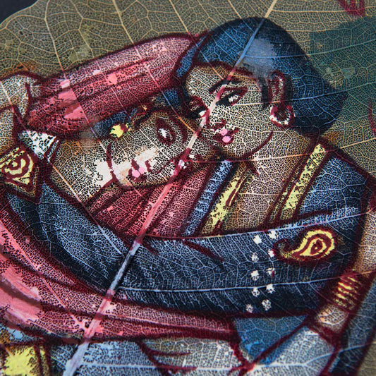 Close-up of peepal leaf painting showing fine brushwork of embracing couple with leaf vein detail, India