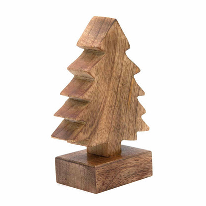 Small carved mango wood Christmas tree, three-quarter angle showing stepped branch profile and grain