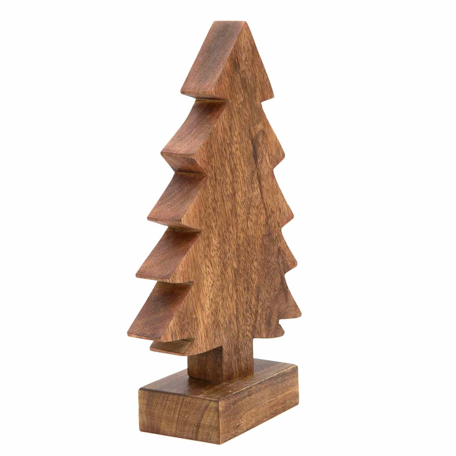 Medium carved mango wood Christmas tree, angled view showing depth of stepped branch layers