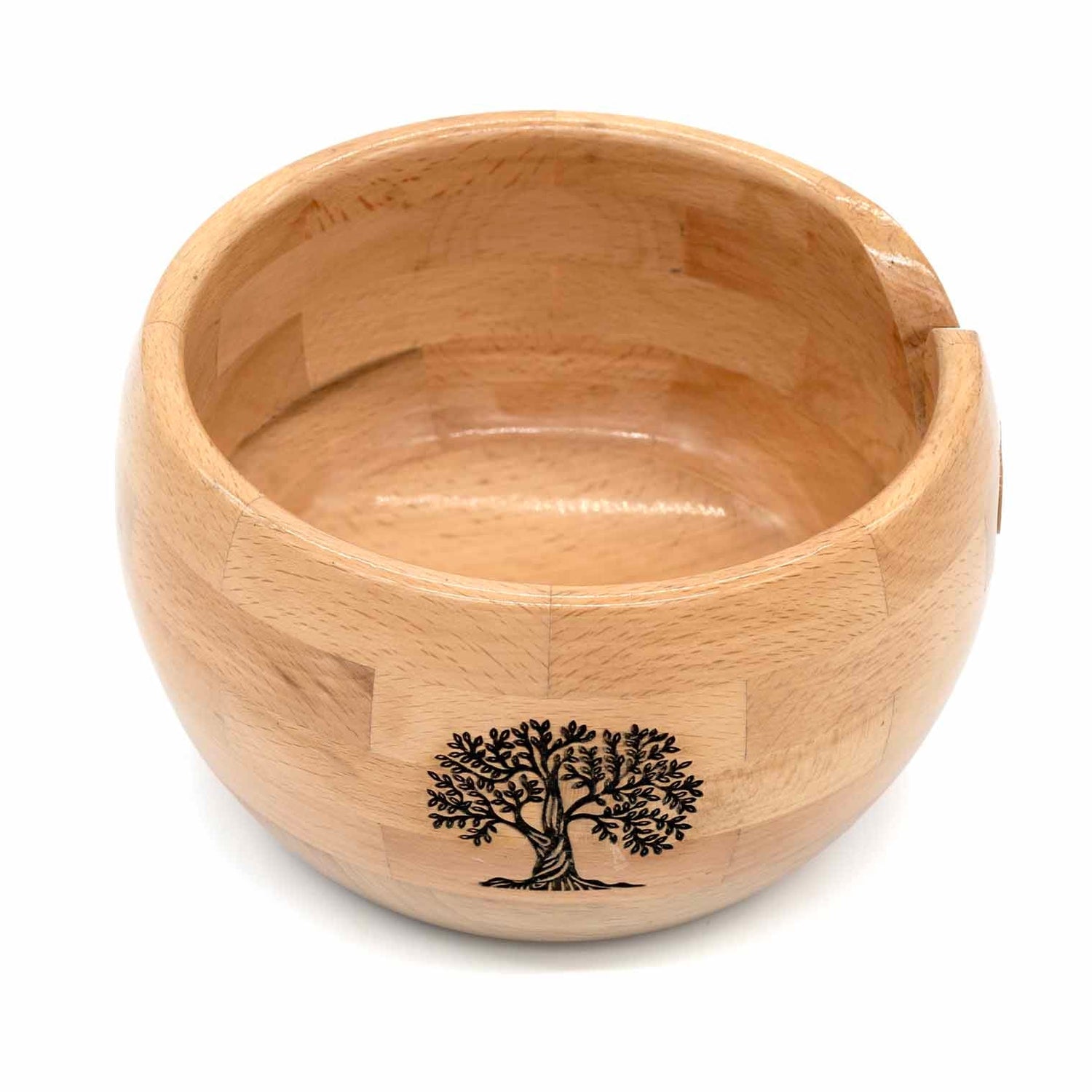 Pale segmented wood yarn bowl with engraved tree motif on outer wall, viewed from front, India