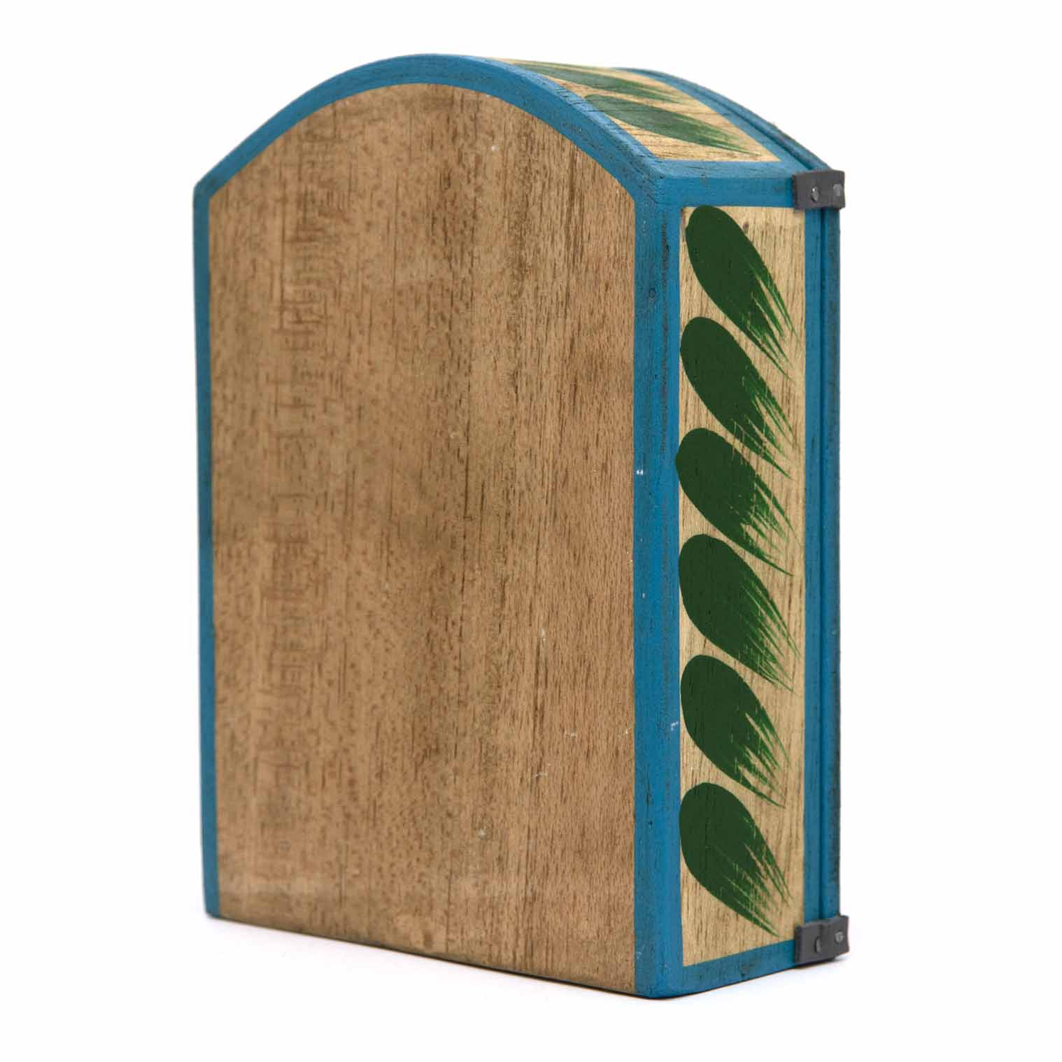 Retablo closed, side view showing plain natural wood grain and blue painted border