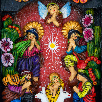 Close-up of nativity scene interior showing hand-modelled clay figures, angel above and llamas below