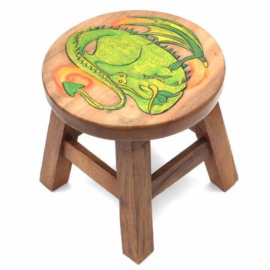 Hand-carved green dragon stool in Raintree wood on white background, showing coiled body, toothed wings and flame detail