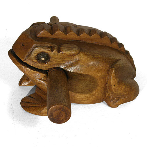 Carved wooden frog guiro, overhead three-quarter view showing ridged back and striker, northern Thailand