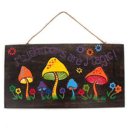 Front view of Mushrooms Are Magic painted wood plank on white background, row of colourful toadstools and flowers