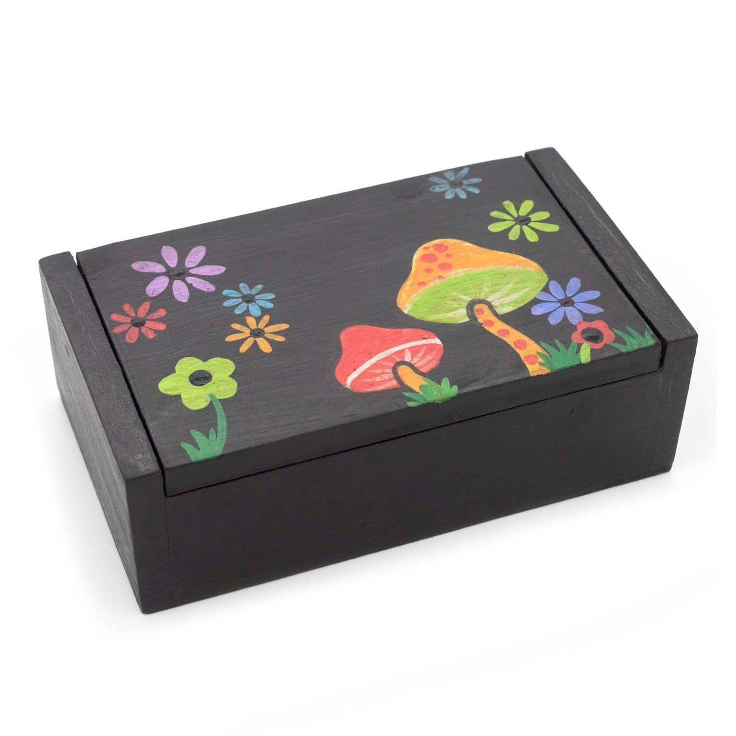 Black wooden box with mushroom and flower painted lid, three-quarter view on white
