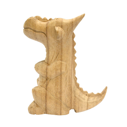 Large hand-carved wooden smoking dragon incense burner, a seated dragon with scaled back, clawed feet and curled tail, with smoke channels carved through the nostrils
