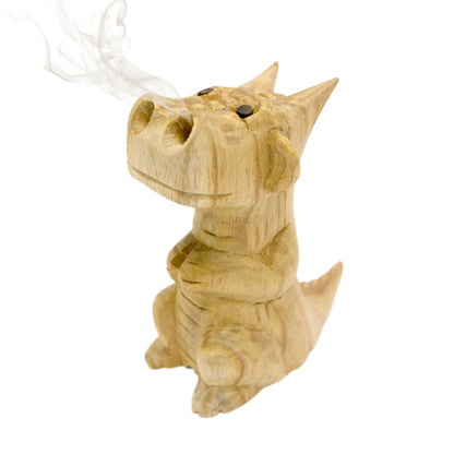 Hand-carved wooden smoking dragon incense burner, a seated dragon with scaled back, clawed feet and curled tail, smoke channels carved through the nostrils