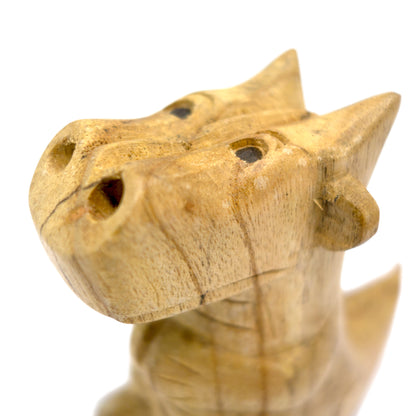 Small hand-carved wooden smoking dragon incense burner, a seated dragon with scaled back, clawed feet and curled tail, smoke channels carved through the nostrils