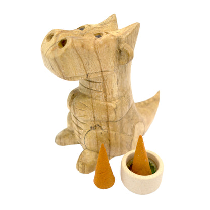 Small hand-carved wooden smoking dragon incense burner, a seated dragon with scaled back, clawed feet and curled tail, smoke channels carved through the nostrils